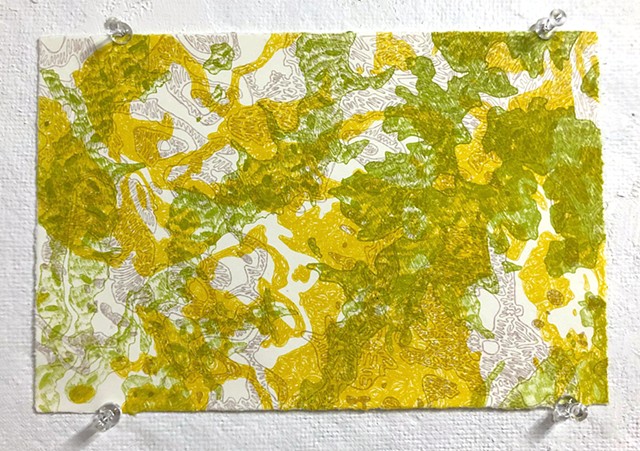 green, yellow, and purple-grey terrain maps printed over each other on white paper