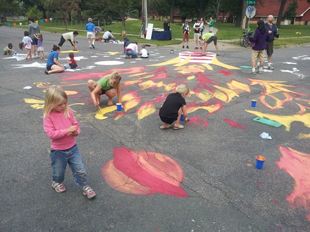 People participating in paint the pavement project