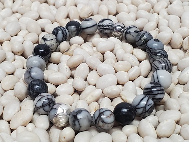 Black Silk Stone Bracelet Matte Black Stone 8mm Beaded Stretch Grounding Healing Bracelet with Red Gemstone. Handmade unisex stretch bracelet for men or women made with 8mm black and white silk stone beads, with a stainless steel bead . Black stones offer