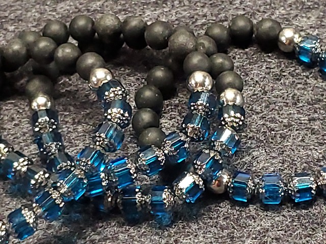 Handmade unisex stretch bracelet made with Red or Blue Czech Glass beads with 8mm matte black stone beads. Healing yoga chakra bracelet. Black stones offer purity, protection, and grounding qualities through the root chakra. Our bracelets are made to last