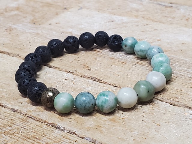 Black Lava Stone and Green Jade 8mm Beaded Stretch Yoga Healing Essential Oil Bracelet. Handmade unisex stretch bracelet made with 8mm black lava stone and jade beads, with brass accents. Each bracelet is made with double-strung .7mm stretch cord, so they