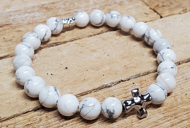 Howlite bracelet with silver cross, Frosted Marble White Genuine Howlite 8mm Beaded Stretch Religious Bracelet with Silver Cross. Handmade bracelet made with 8mm white Howlite beads, silver cross and accent beads. Howlite encourages creativity, communicat