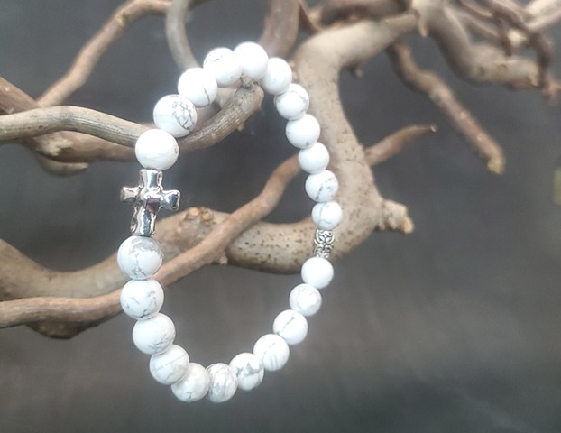 Howlite bracelet with silver cross, Frosted Marble White Genuine Howlite 8mm Beaded Stretch Religious Bracelet with Silver Cross. Handmade bracelet made with 8mm white Howlite beads, silver cross and accent beads. Howlite encourages creativity, communicat