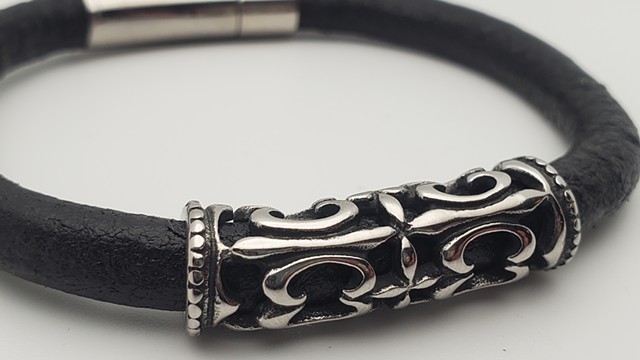 Cut-out Fleur de lis Stainless and Leather Bracelet, with magnetic locking clasp  