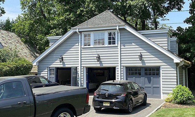 Wright Robinson Architects. Historic District. Painted wood siding. Custom Garage Doors. Jerkinhead roof.