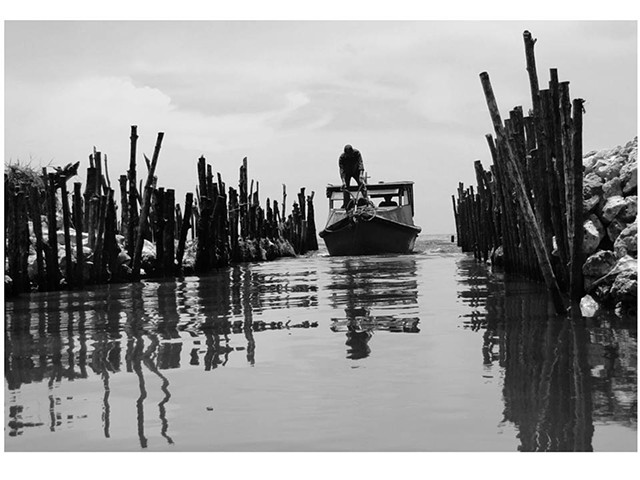 Cuba photograph B&W of sea stakes sky narrow entrance islands about emigration mal du pays nostalgia by Aramis Justiz