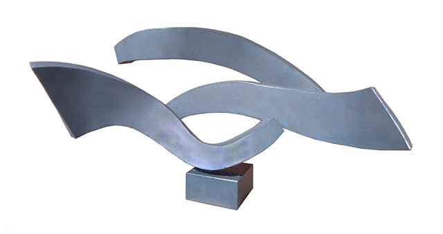 Steel Sculpture represents waves in the wind flowing forms clean geometric lines by Aramis Justiz