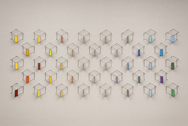 Wall sculpture in 38 parts.  Piece is designed to be modular and fit a variety of spaces.