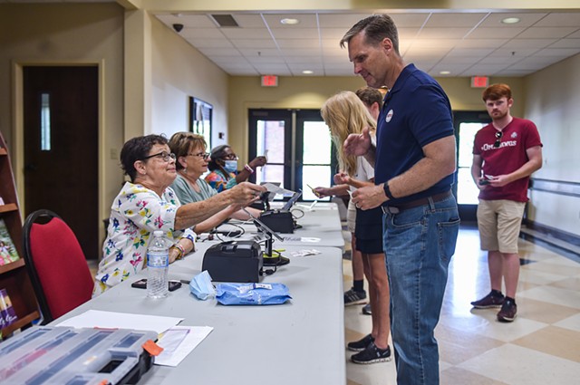 Rep. Michael Guest (R-Miss.) arrives with family to cast his vote in the Mississippi Congressional primary at Brandon Baptist Church in Brandon, Miss., Tuesday, June 7, 2022.