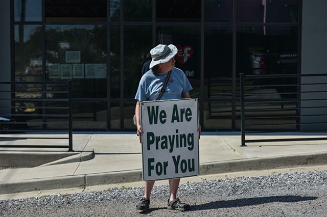 Doug Heiser, an anti-abortion advocate, holds a sign at the Jackson Women's Health Organization after the U.S. Supreme Court overturned Roe v. Wade in Jackson, Miss., Friday, June 24, 2022.