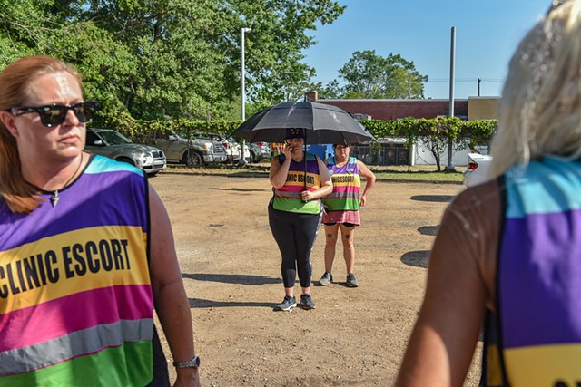 Clinic escorts wait outside of the entrance to the Jackson Women's Health Organization minutes after the U.S. Supreme Court overturned Roe v. Wade in Jackson, Miss., Friday, June 24, 2022.