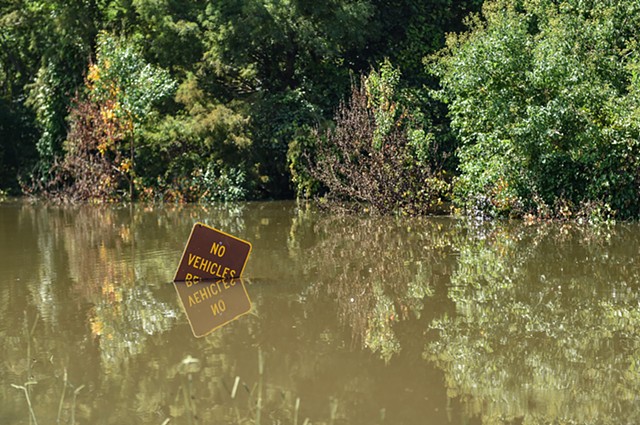 A sign is seen submerged under water near Spillway Overlook in Brandon, Miss., Sunday, August 28, 2022.