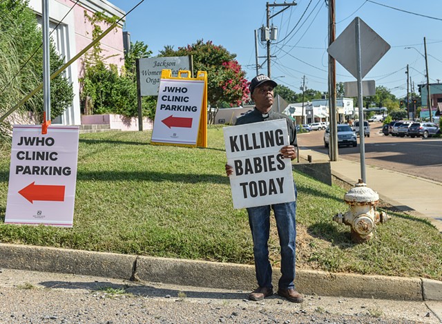 Anti-abortion advocate Edward Smith, 71, holds a sign outside of the Jackson Women's Health Organization after the U.S. Supreme Court overturned Roe v. Wade in Jackson, Miss., Friday, June 24, 2022.