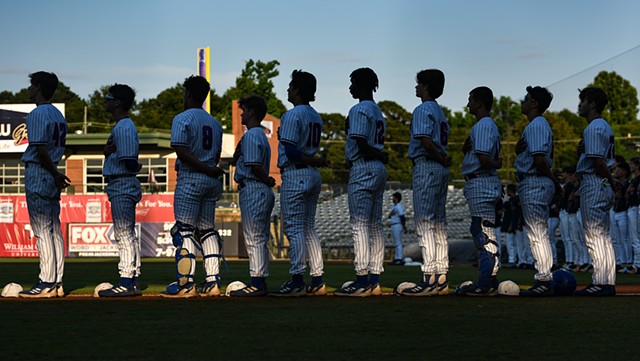 Gulfport players line up for the pledge of allegiance ahead of the MHSAA class 6A baseball championships against Lewisburg at Trustmark Park in Pearl, Miss., Thursday, June 1, 2023.