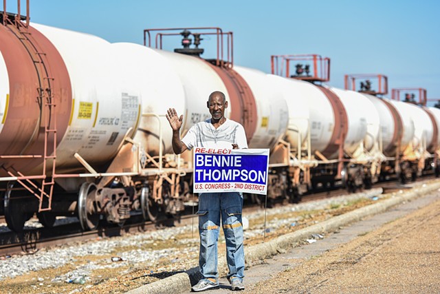 Poll worker Robert McGee of Jackson stands on Mill Street holding a sign for U.S. Rep. Bennie Thompson in Jackson, Miss., November 8, 2022.