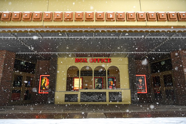 Snow falls outside of the Tennessee Theatre in Knoxville, Monday, Jan. 15, 2024.