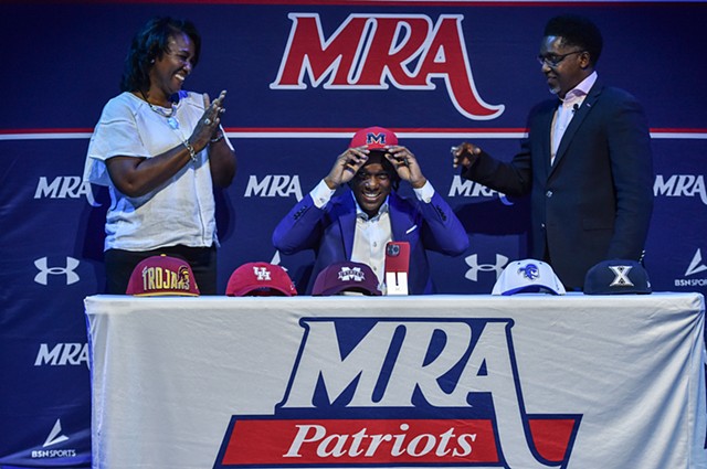 Josh Hubbard, point guard for Madison-Ridgeland Academy, is cheered on by his parents as he commits to the University of Mississippi at Madison-Ridgeland Academy in Madison, Miss., Thursday, September 22, 2022.