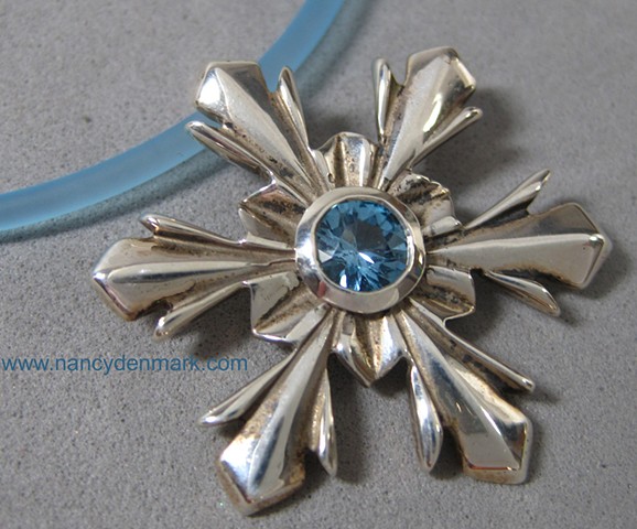 sterling silver snowflake pendant with blue topaz © Nancy Denmark