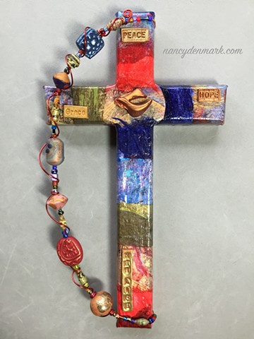 Messenger of Peace symbol on collage cross by Nancy Denmark
