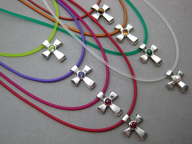 © Nancy Denmark gemstone ribbon crosses shown on colored cord necklaces