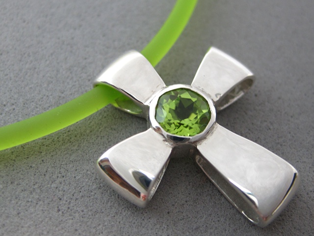 sterling silver ribbon cross with faceted peridot © Nancy Denmark