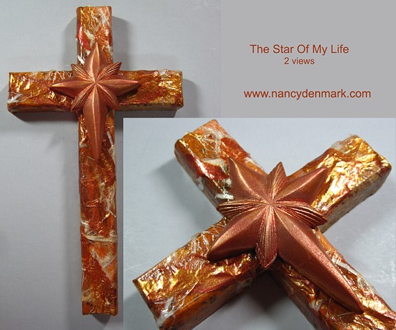Star symbol on wood collage cross by Nancy Denmark and Patti Reed