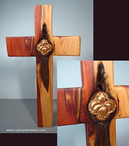 collaborative cedar cross by Margaret Bailey with Nancy Denmark's lily quatrefoil symbol