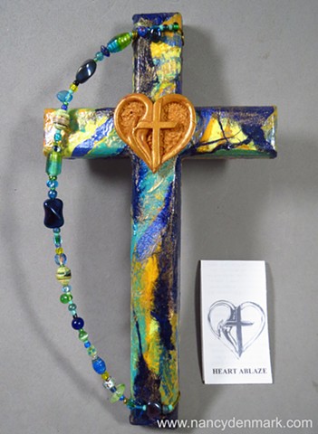 collage wall cross with polymer clay symbol by Nancy Denmark