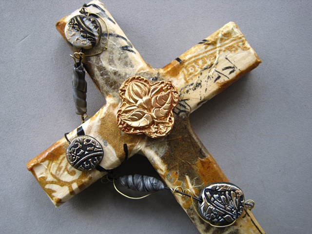 collage wall cross by Patti Reed embellished with Nancy Denmark polymer clay symbols