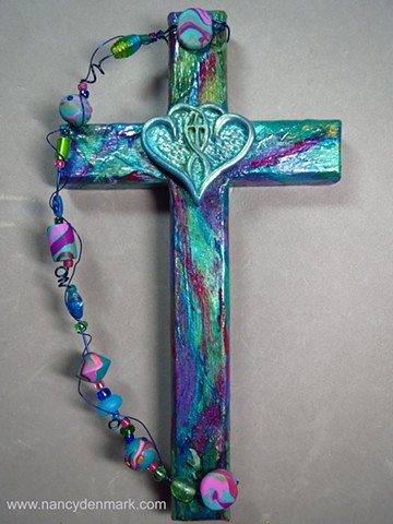 One In The Spirit symbol on collage cross made by Nancy Denmark