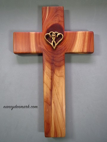 collaborative cedar cross by Margaret Bailey with Nancy Denmark's One In The Spirit symbol