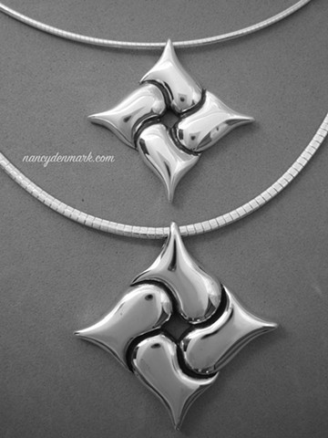 sterling silver entwined hearts pendant design by Nancy Denmark