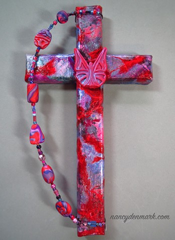 butterfly symbolism on collage wall cross by Nancy Denmark