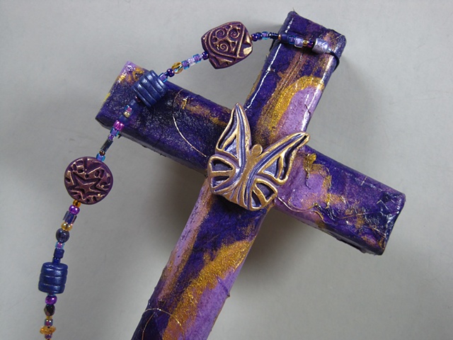 BE YE TRANSFORMED 
ON PURPLE COLLAGE CROSS
CLOSE UP VIEW