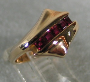 14K RING WITH CHANNEL OF RUBIES VIEW 2