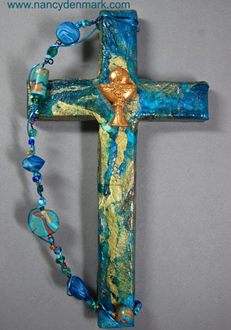 chalice and host symbol on collage wall cross by Nancy Denmark and Patti Reed