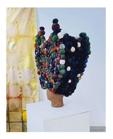 Sculpture made from recycled dryer lint and turned into a crown by artist Katlynne Hummell Underhill