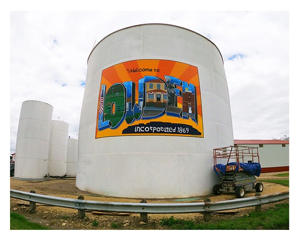 A Postcard mural painted by artist Katlynne Hummell Underhill in Lowden Iowa on an agvantage steel tank.