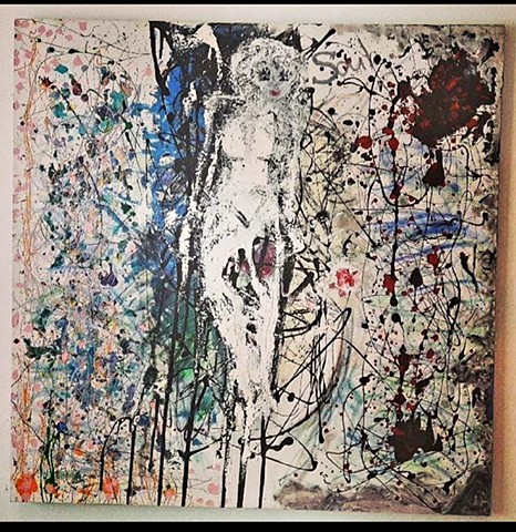 A painting of a female figure in the center of the frame with splatter paint covering the surface.