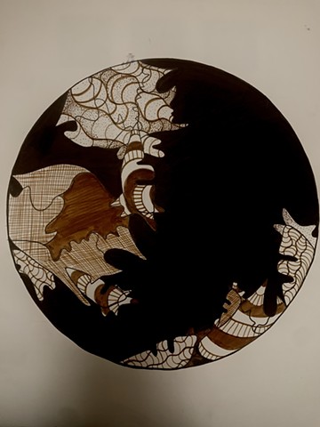 A drawing in marker of a black filled in circle with patterning. 