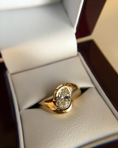 Half bezel set wedding ring with diamond. 