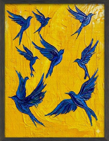 Blue birds in flight 