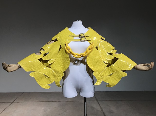Face Your Fear is a ceremonial wrestling cape, designed with Texas Tech ADM professor Rachel Anderson. The reverse bares an abstracted face with full lips and winged eyelashes in a nod to Mexican and Japanese wrestling mask design.