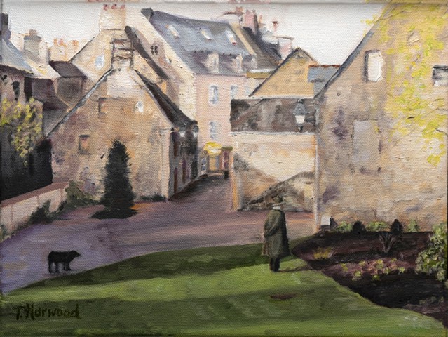 Man in courtyard looking at garden with dog