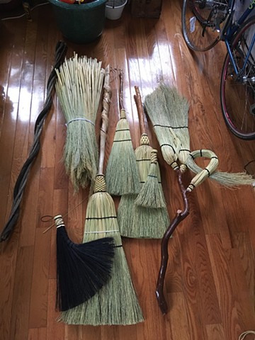 collection of hand tied brooms by Allison Halter