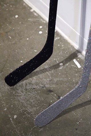 Hockey sticks affixed with glitter