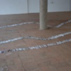 Exhibition Flying Carpet Prayers at El Pósito, rolled newspaper from Catalunya in the shape of Cañadas Real