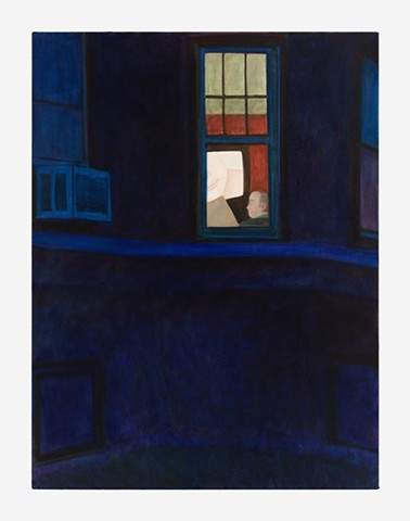 a man in a window at night