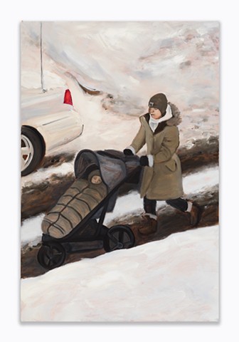 A woman pushing a stroller down a snowy street