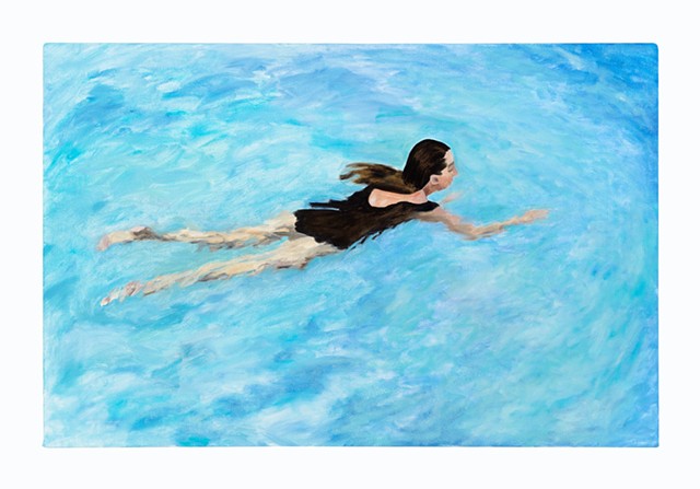 a woman swimming in a pool